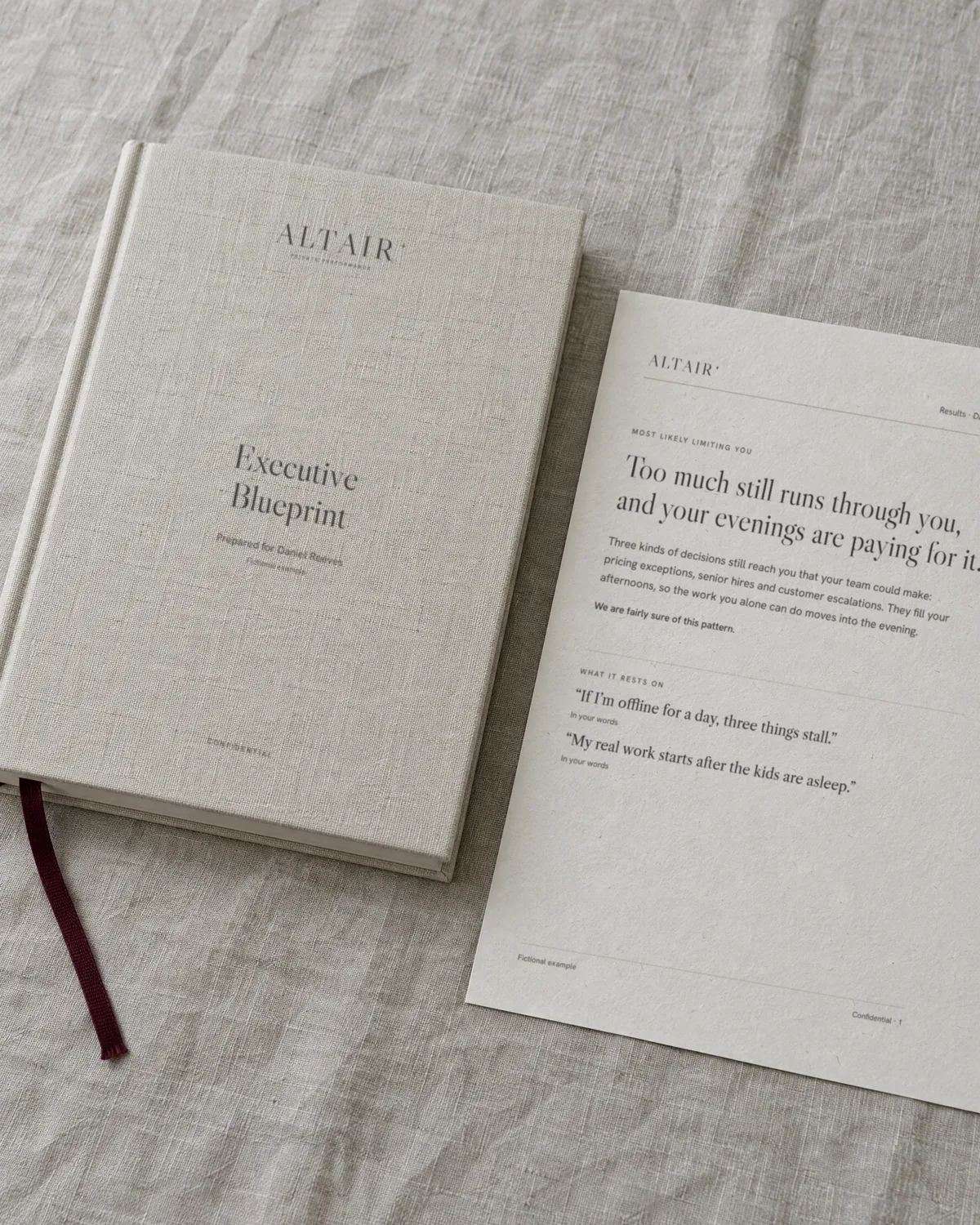 The Executive Blueprint and a printed results page on natural linen in daylight.